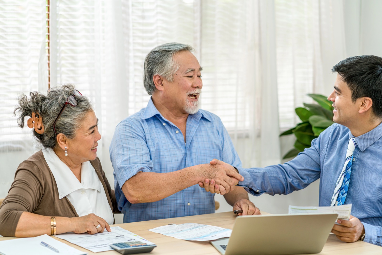 Advisor shaking hands with a client